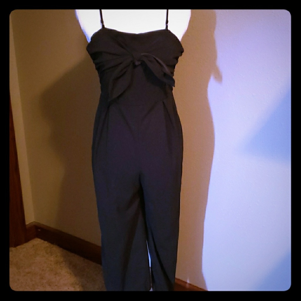 Lush black jumpsuit with bow detail